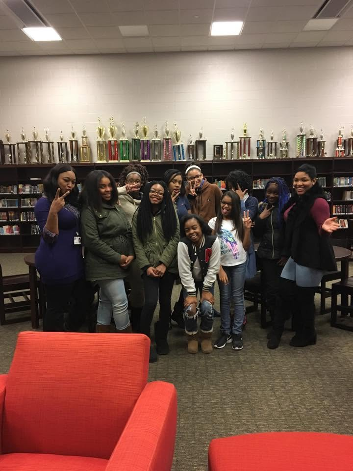 AmazinnMe youth and mentors gathered together in a library